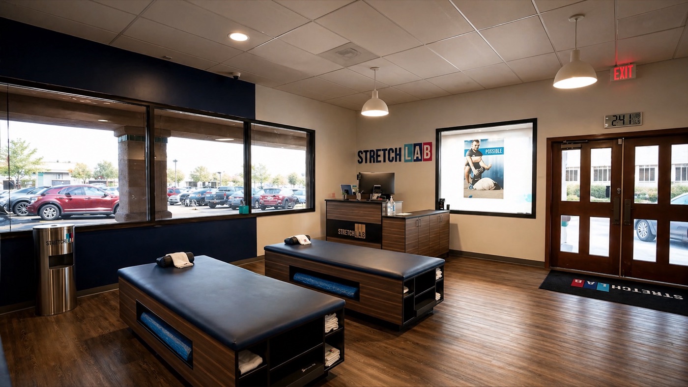 StretchLab franchise studio with stretch tables under pendant lights and recessed downlights